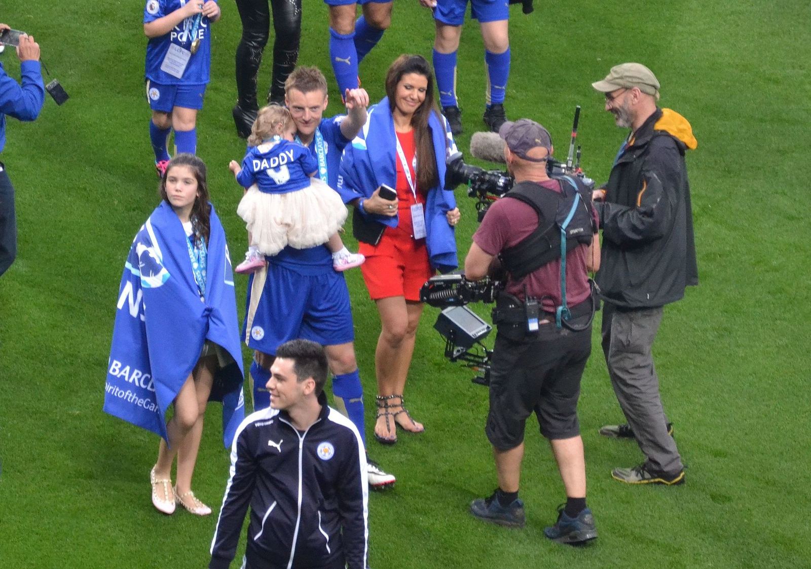 Jamie Vardy and his family on the pitch at the King Power Stadium